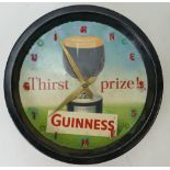1950s Guinness tin plate clock: 1950s Guinness Thirst Prize clock with pendulum and weight.