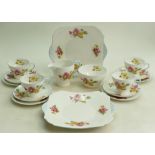A collection of Shelley Begonia patterned tea ware: To include 10 x saucers, 12 x side Plates,
