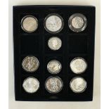 10 assorted silver Coins: USA $1 - 1890 & 1896, Cook Islands $10 James Cook, Britannia £2 2011 1oz,