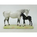 Beswick Mare and Foal on base: Beswick grey mare with black foal on ceramic grass base model 1811.