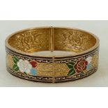 Enamelled gold coloured metal bangle (tested 18ct): Enamelled gold coloured metal bangle (tested