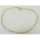 Yellow coloured metal necklace: Tested to be high carat gold possibly 22ct Lead soldiered repair to