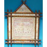 Sampler dated 1872: Gothic style painted wood frame measuring 89cm x 72cm overall.