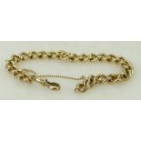 9ct gold Bracelet: Hallmarked 9ct gold gents flat curb link bracelet, 10cm long. Weight 33.3g.
