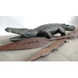 Half Sized Carved African Crocodile and Spears: Carved crocodile together with 2 similar tourist