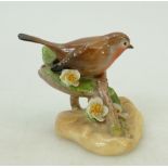 Royal Doulton rare bird Robin HN2549: Perched on a floral branch dated 1942, height 7cm.