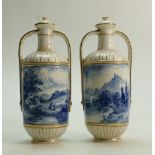 A pair of Wedgwood Twin Handled Lidded Bottle Vases: Gilded and Hand painted Highland Landscape