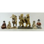 A collection of Japanese porcelain figures: Japanese seated pottery figures and resin double figure