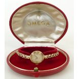 9ct 1950s ladies Omega Wristwatch: With 9ct gold bracelet in original box, gross weight 16.5 grams.