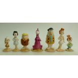 A collection of Beswick Flintstones figures: Fred and Wilma, Pebbles Flintstone, Barney and Betty,