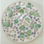 Lise Moorcroft pottery Charger decorated in the Jigger Jolly blackberry design, dated 1990,