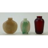 Three Chinese Peking Glass and Jade Snuff Bottles: A round shape beige colour jade bottle,