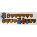 17 Ships Plaques on wooden shields: Ships mess room plaques x 17, ranging in size from 18cm - 25cm,