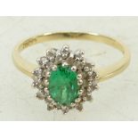 14ct gold Ring set with Diamonds and oval Emerald stone 3.5 grams.