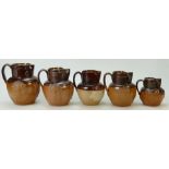 Royal Doulton Lambeth Stoneware Coronation Jugs: Four jugs in various sizes,