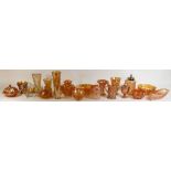 A collection of Orange Carnival Glass Items to include: Vases, bowls lidded jars,