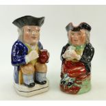 Two early 19th century Toby Jugs: Large one with blue coat (24cm high) has crazing and cracking,