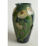 Moorcroft vase decorated with green & white flowers,height 19cm.