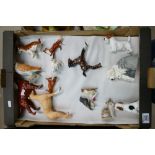 A collection of Royal Doulton & Beswick to include Sealyham Terrier, Hound,