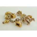 9ct gold charm bracelet : with 10 good quality 9ct gold charms, 44.9 grams.