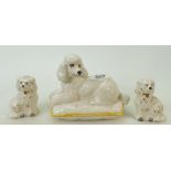 Royal Doulton Dogs: Royal Doulton large white Poodle on cushion and a pair of small spaniel dogs.