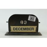 A vintage bronze perpetual desk calendar: A vintage bronze perpetual desk calendar