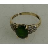 9ct gold ladies dress ring set with green stone,size L,1.9 grams.