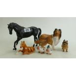 A collection of Beswick figures to include: Black Beauty, Palomino Foal, Cairn Terrier,