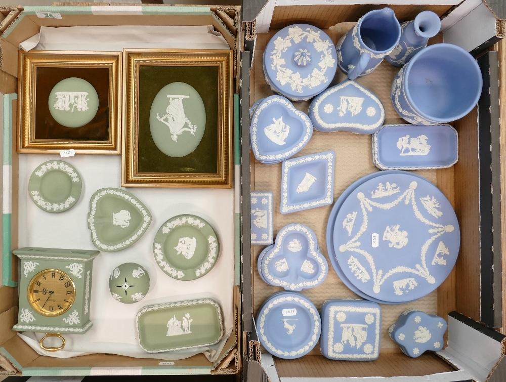 A large collection of Wedgwood jasperware including a mantle clock: wall plates, planter, jug, pin