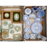 A large collection of Wedgwood jasperware including a mantle clock: wall plates, planter, jug, pin