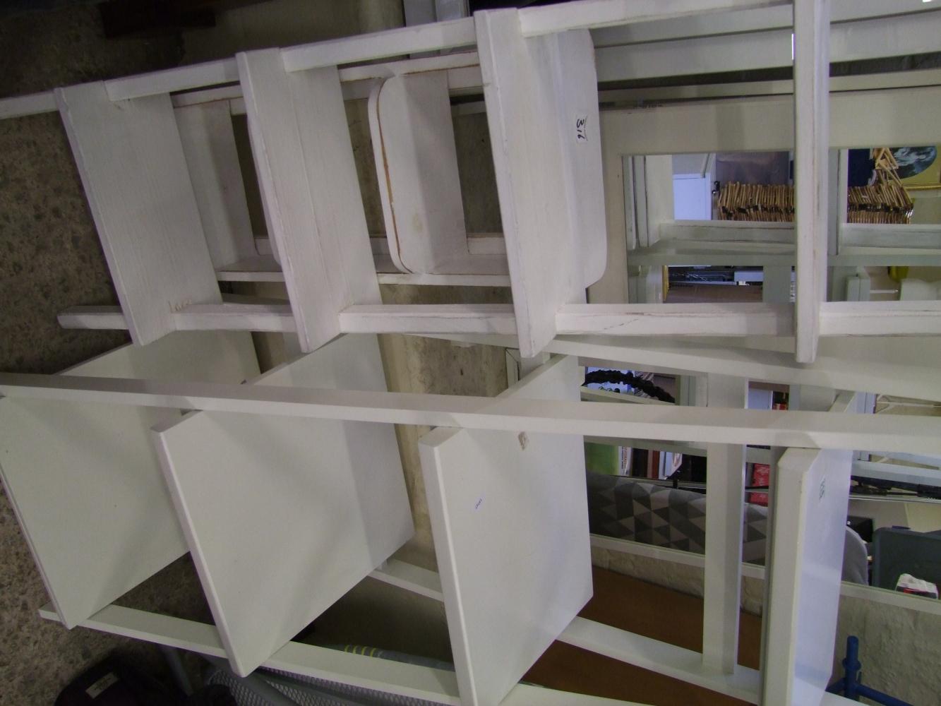 A small group of white shelving units: (3)