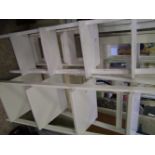 A small group of white shelving units: (3)