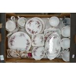 A Royal Albert Lavender Rose Tea set: to include 6 cups and saucers, 6 side plates, cake plate,