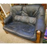 A two seater oak framed blue leather sofa: