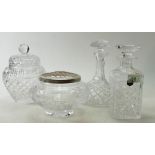 A collection of quality cut glass crystal items to include: decanters, lidded vase and flower