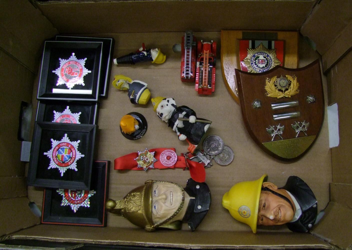 A collection of fire brigade memorabilia: to include Bossons wall plaques, medals, station officer