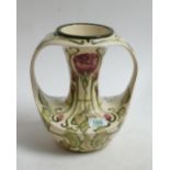 Cobridge stone ware twin handled vase: in the Florian rose pattern, signe M Goodwin. Height 27cm