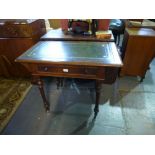 A Victorian mahogany ladies writing table with one drawer on turned fluted legs