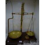 Vintage brass weighing scales by Avery complete with weights on hardwood bass