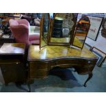 A 1930's burr walnut dressing table with triple mirror and matching bedside cupboard