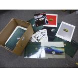 Two cartons of car brochurs and similar relating to Lotus and Vauxhall vehicles