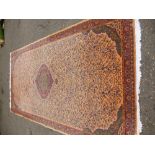 Modern Persian style carpet with central spandrel in a peach field 384x200cm