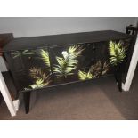 A black painted vintage sideboard having Decoupage bamboo leaf decoration 124cms.