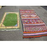 Old geometric kelim rug 300 x 166 and one other smaller rug having green field