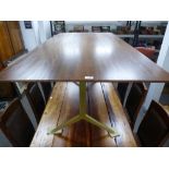 A modern oblong dining table with dark hardwood top on metal supports 180.5cms