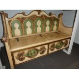 A Gothic style painted hall seat having arched back 142cm