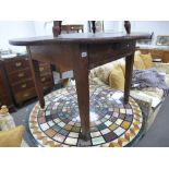 An Antique French Fruitwood dining table with on drawers on square legs 109.5cms