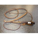 An early 20th Century braided leather horse whip, with a mahogany conical tapered handle