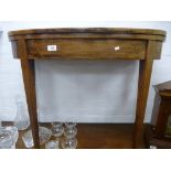 A Georgian mahogany fold over card table with inlaid decoration on square tapering legs 89cms