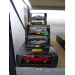 13 boxed 1:26 and 1:18 scale 'Maisto' sports cars.